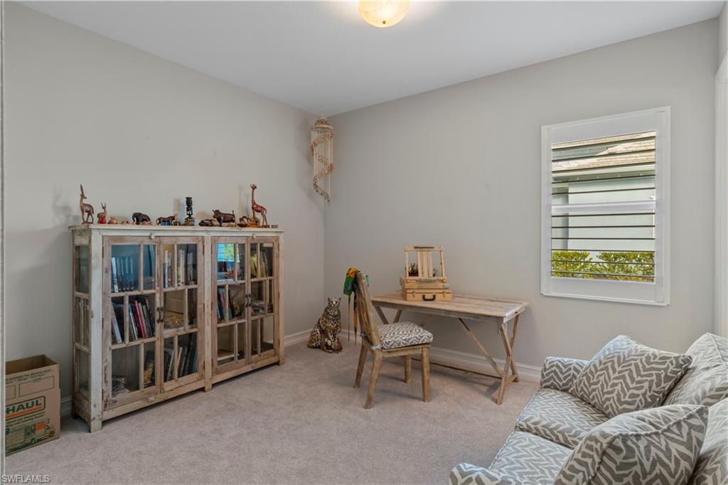 6254 Lightbourn Way Naples, FL 34113 - Photo 33 of 34 a bedroom with furniture and a window