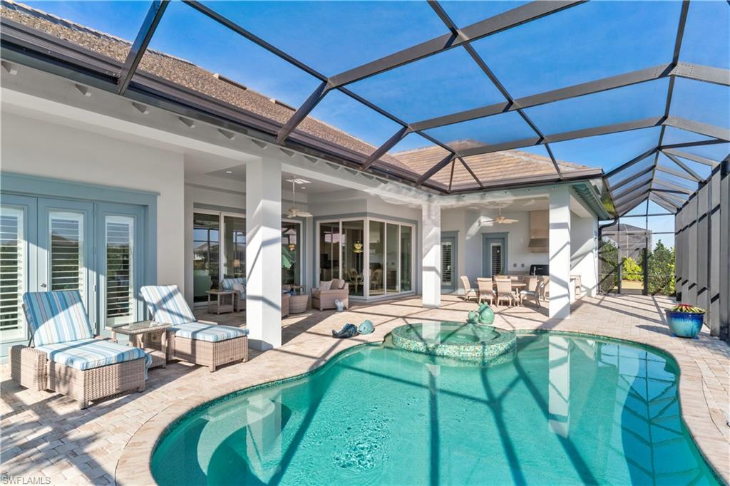 6254 Lightbourn Way Naples, FL 34113 - Photo 6 of 34 a view of a backyard with sitting area