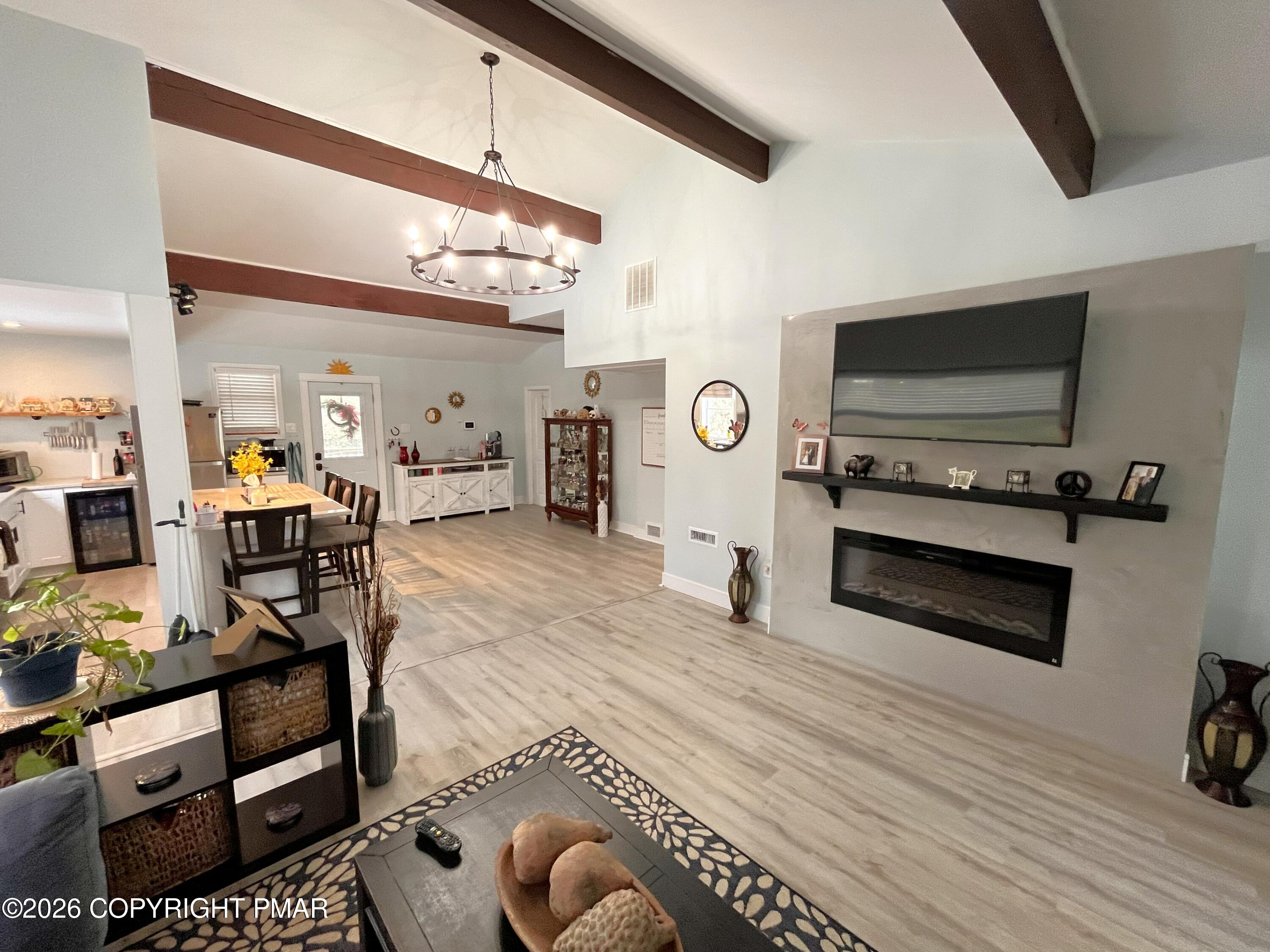 29 Hopi Road Jim Thorpe, PA 18229 - Photo 2 of 44 a living room with furniture and a flat screen tv