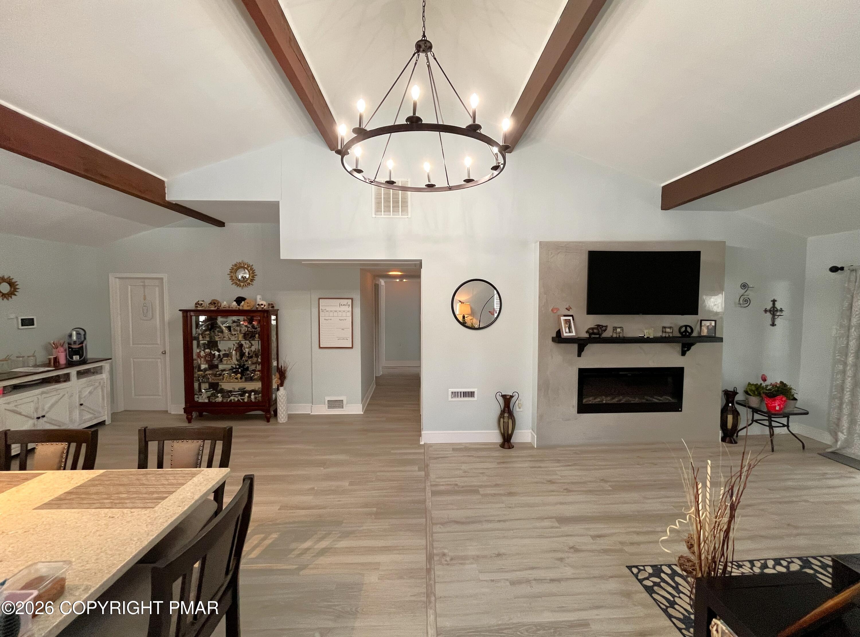 29 Hopi Road Jim Thorpe, PA 18229 - Photo 25 of 44 a living room with furniture a flat screen tv and a fireplace