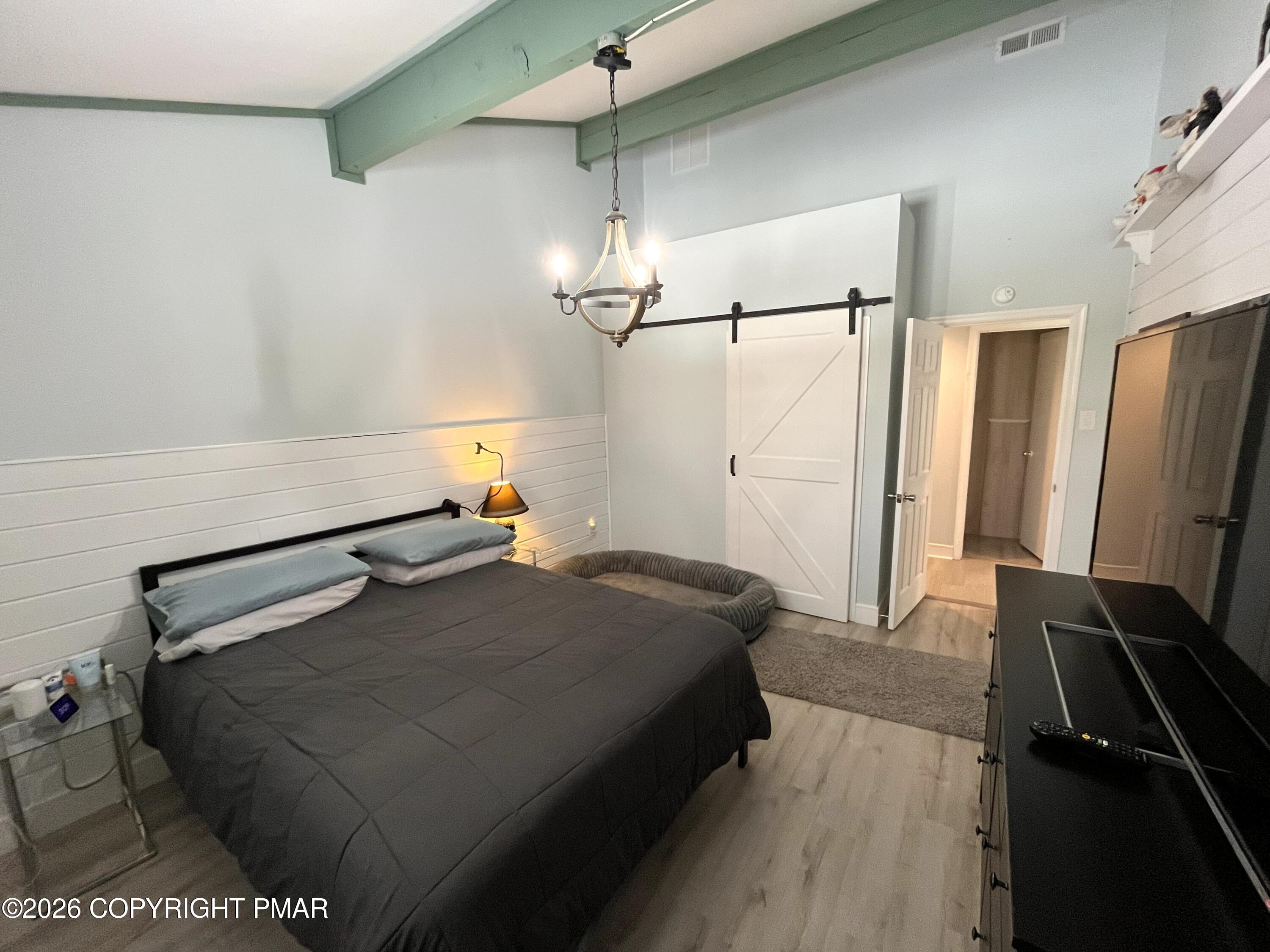 29 Hopi Road Jim Thorpe, PA 18229 - Photo 27 of 44 a bedroom with a bed and a mirror