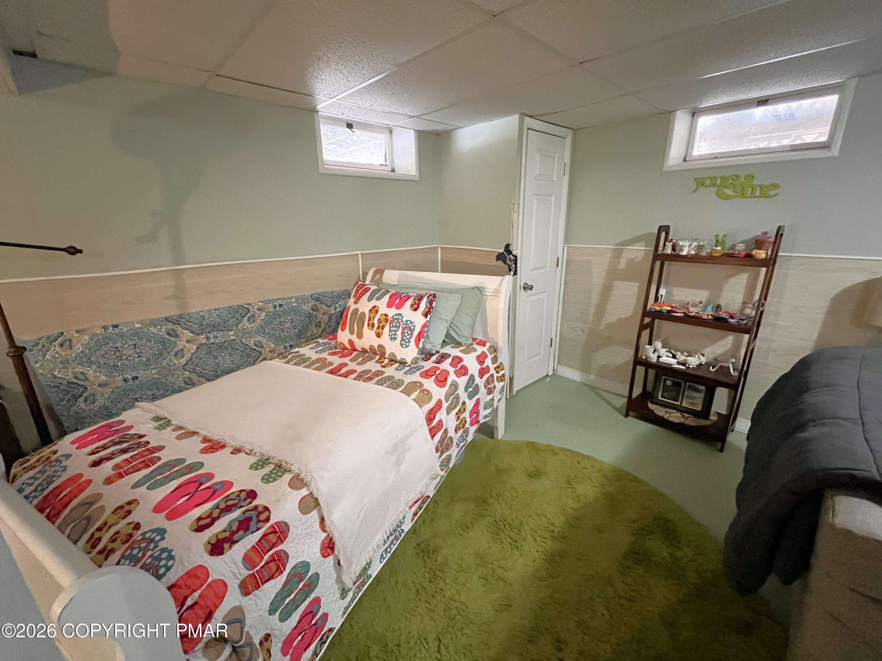 29 Hopi Road Jim Thorpe, PA 18229 - Photo 37 of 44 a bedroom with a bed and a chandelier