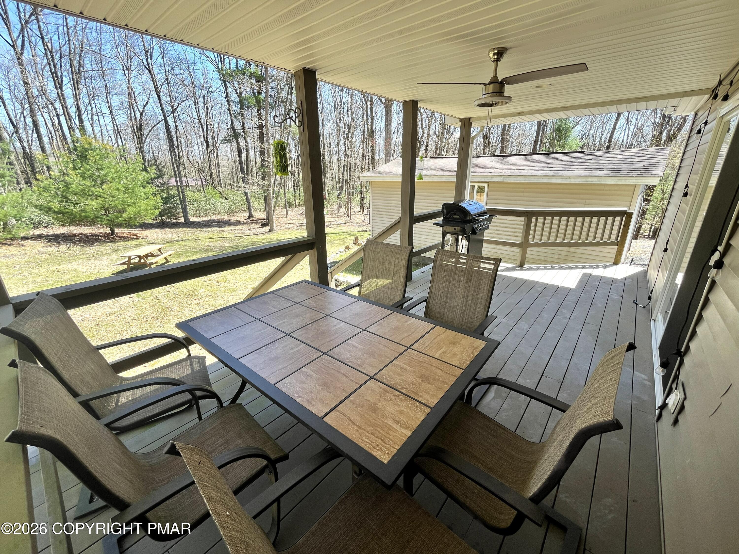 29 Hopi Road Jim Thorpe, PA 18229 - Photo 42 of 44 a view of a patio with table and chairs and wooden floor