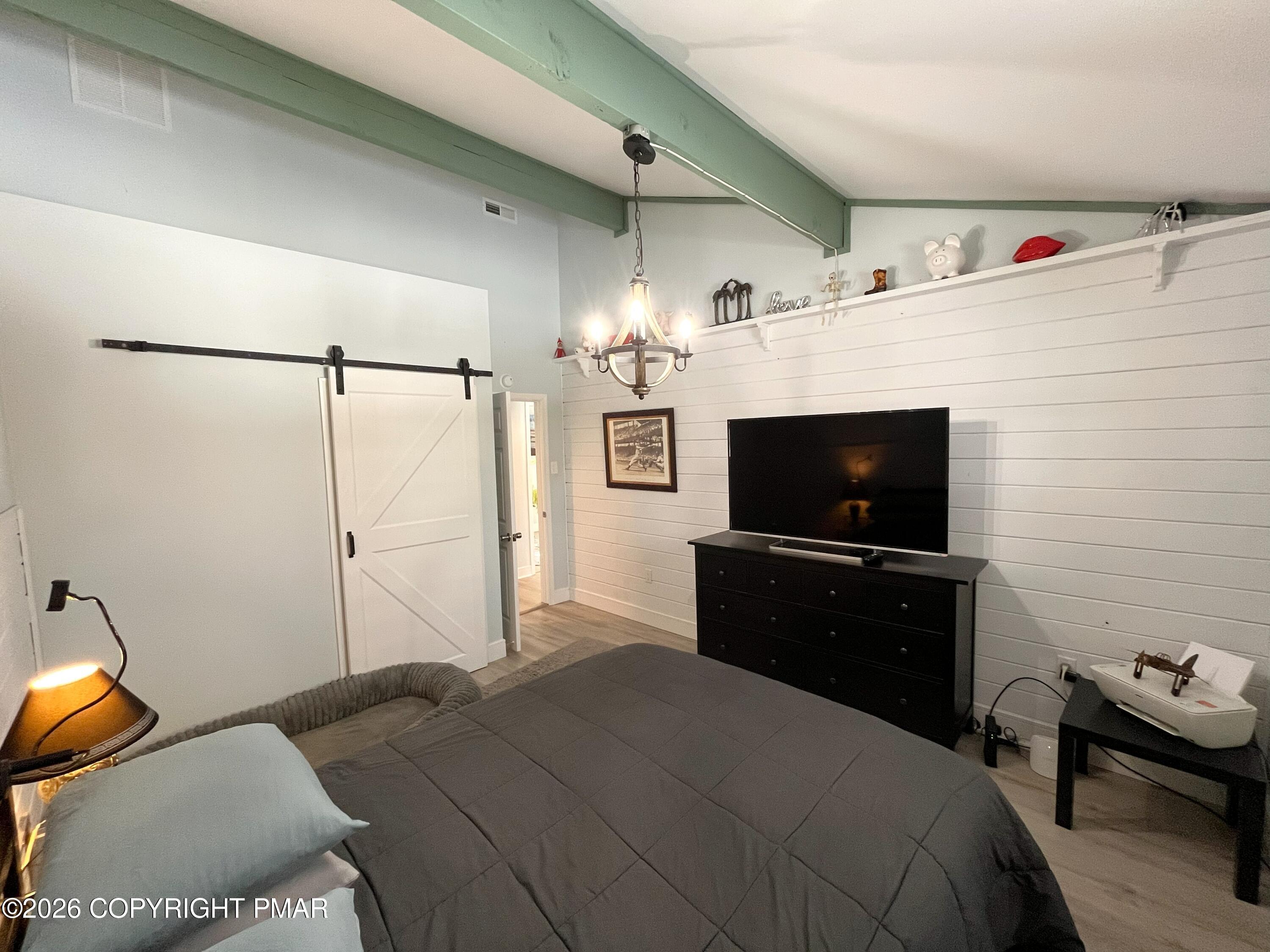 29 Hopi Road Jim Thorpe, PA 18229 - Photo 6 of 44 a bedroom with a bed and a flat screen tv