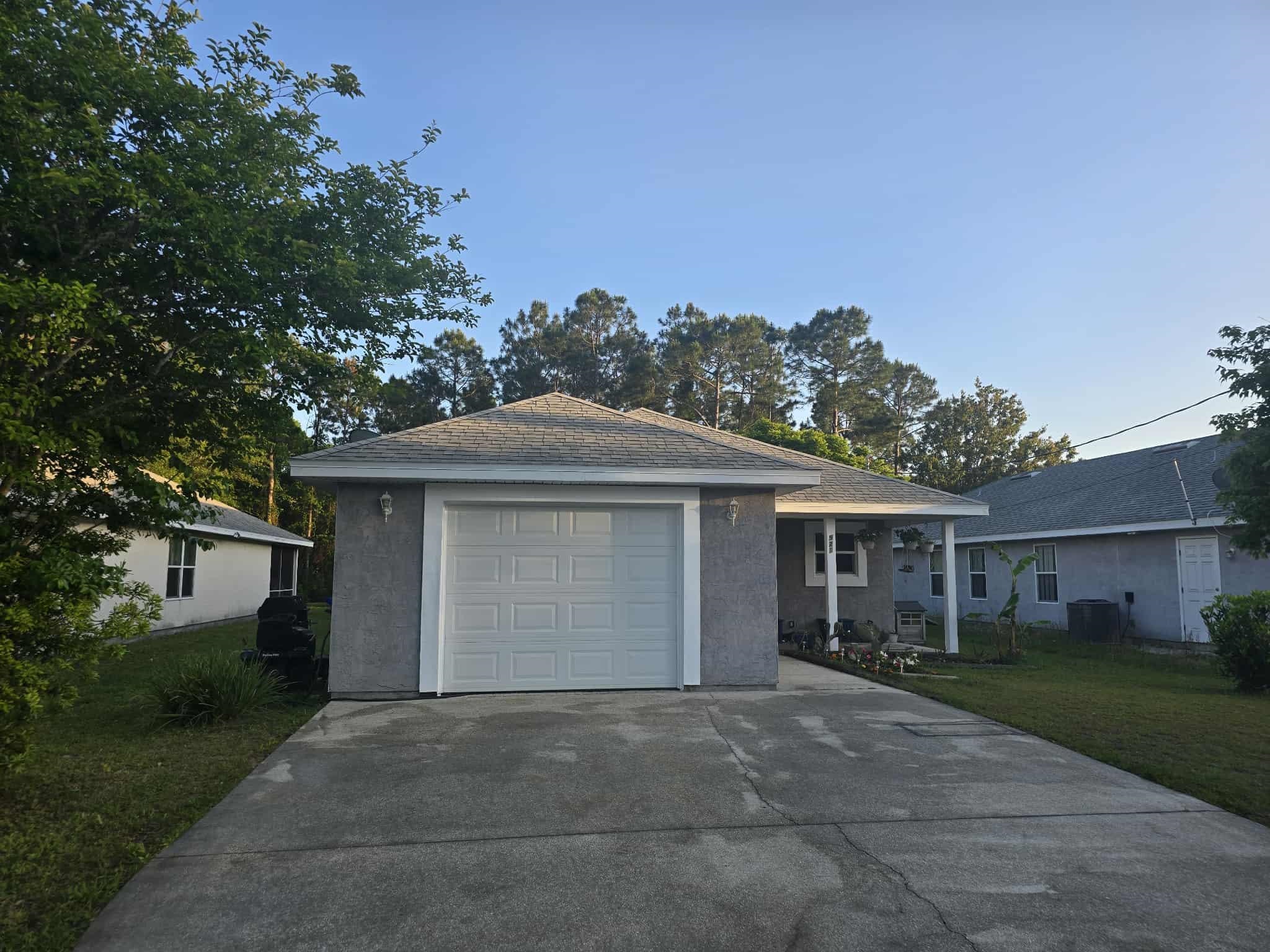 front view of a house with a garden