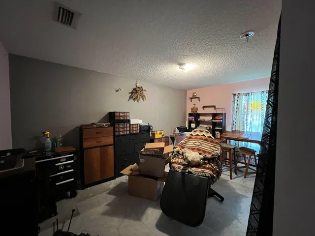 a bed room with furniture and a window