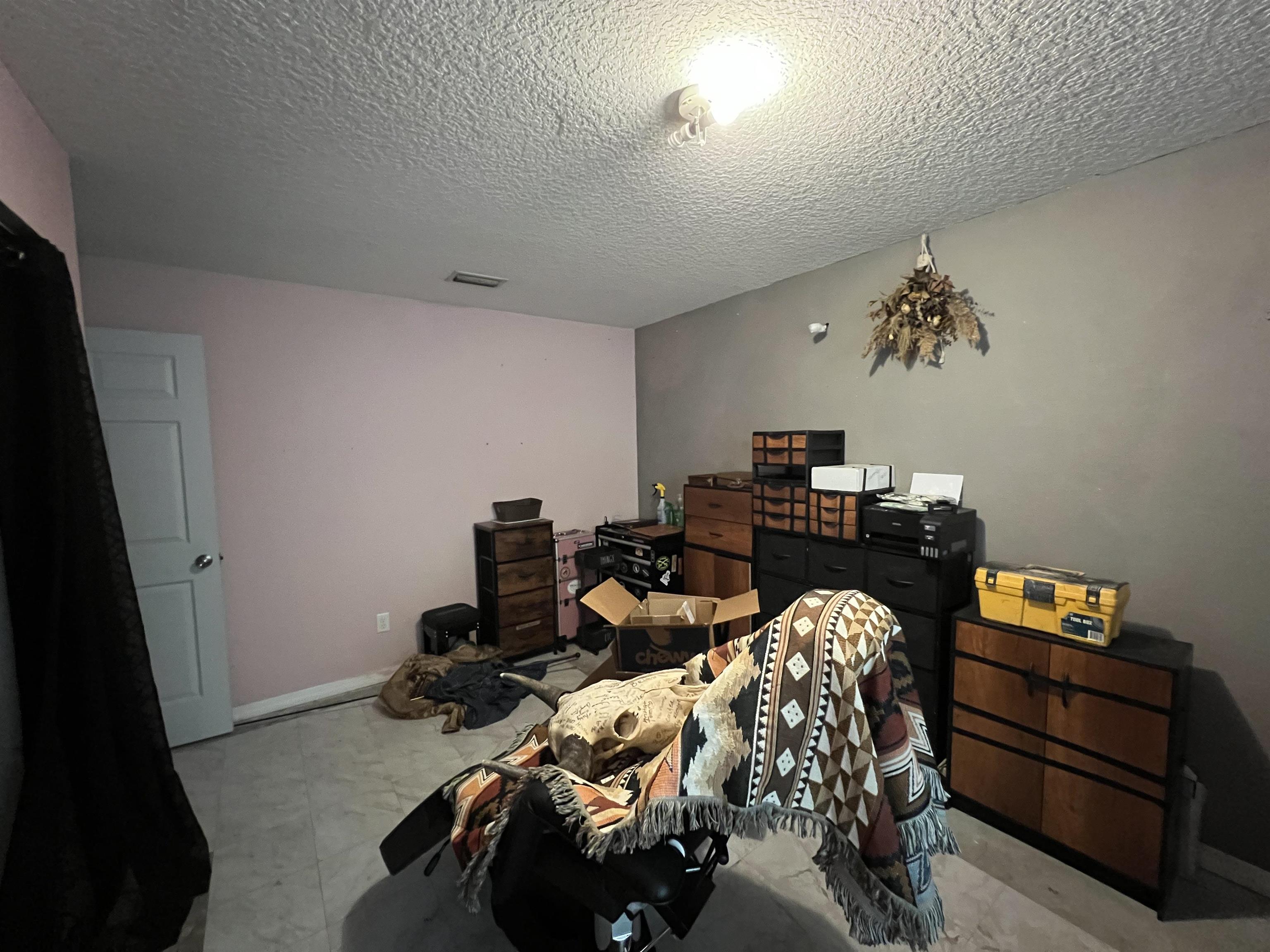 921 Avery Street St. Augustine, FL 32084 - Photo 13 of 29 a bed room with a bed and a tv