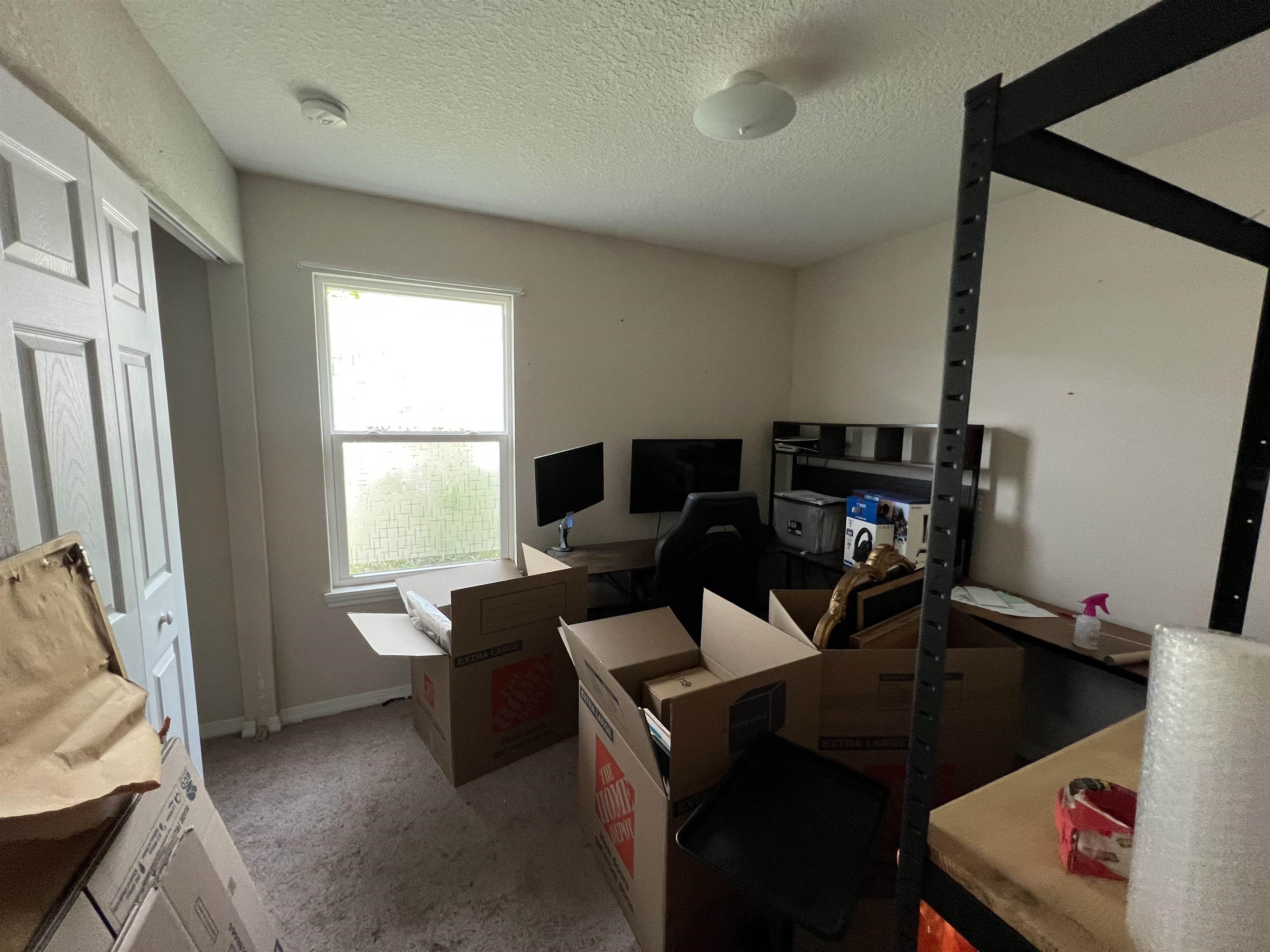 921 Avery Street St. Augustine, FL 32084 - Photo 14 of 29 a view of a workspace with furniture and a window