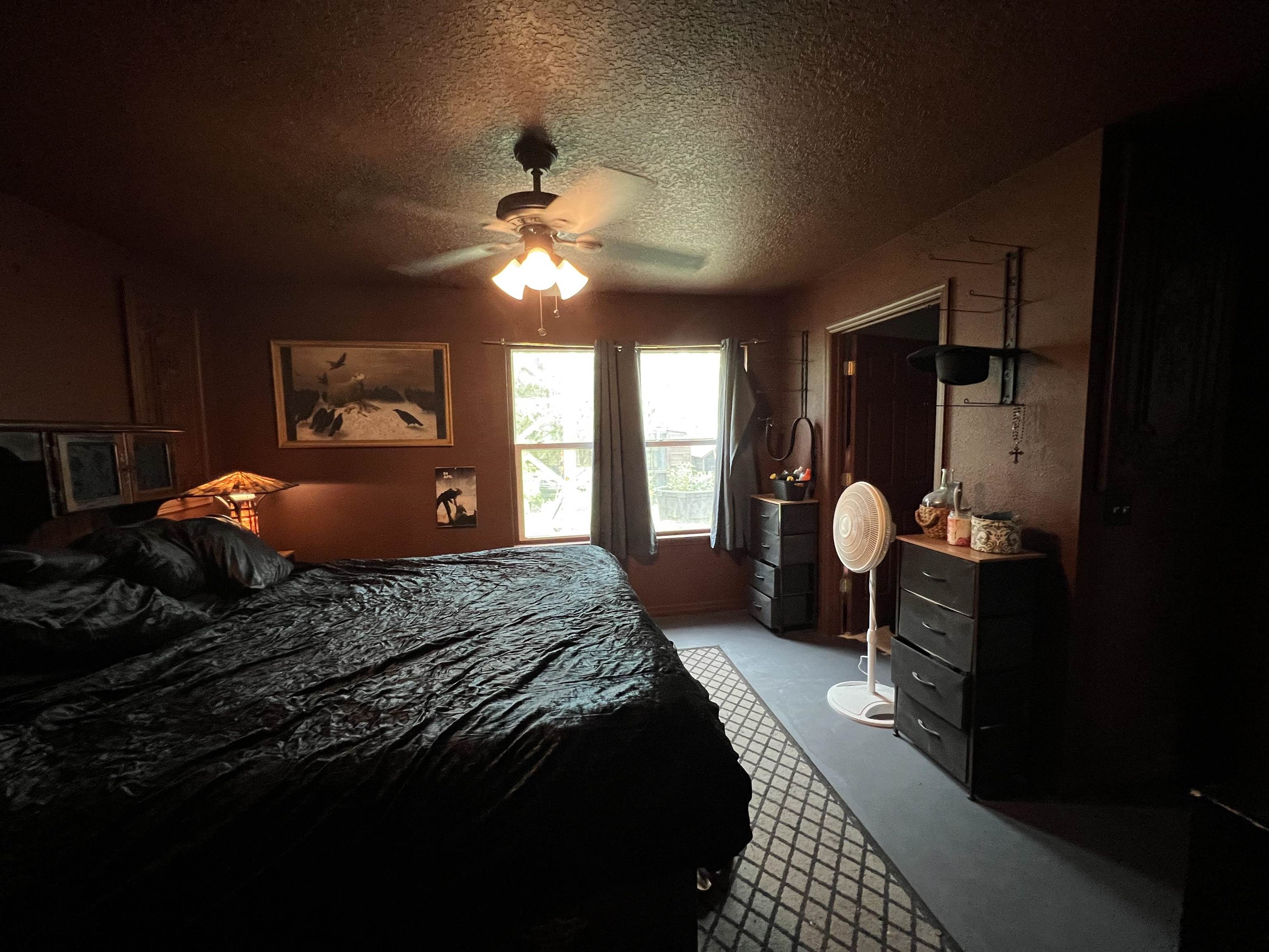 921 Avery Street St. Augustine, FL 32084 - Photo 19 of 29 a bedroom with a bed and a chandelier