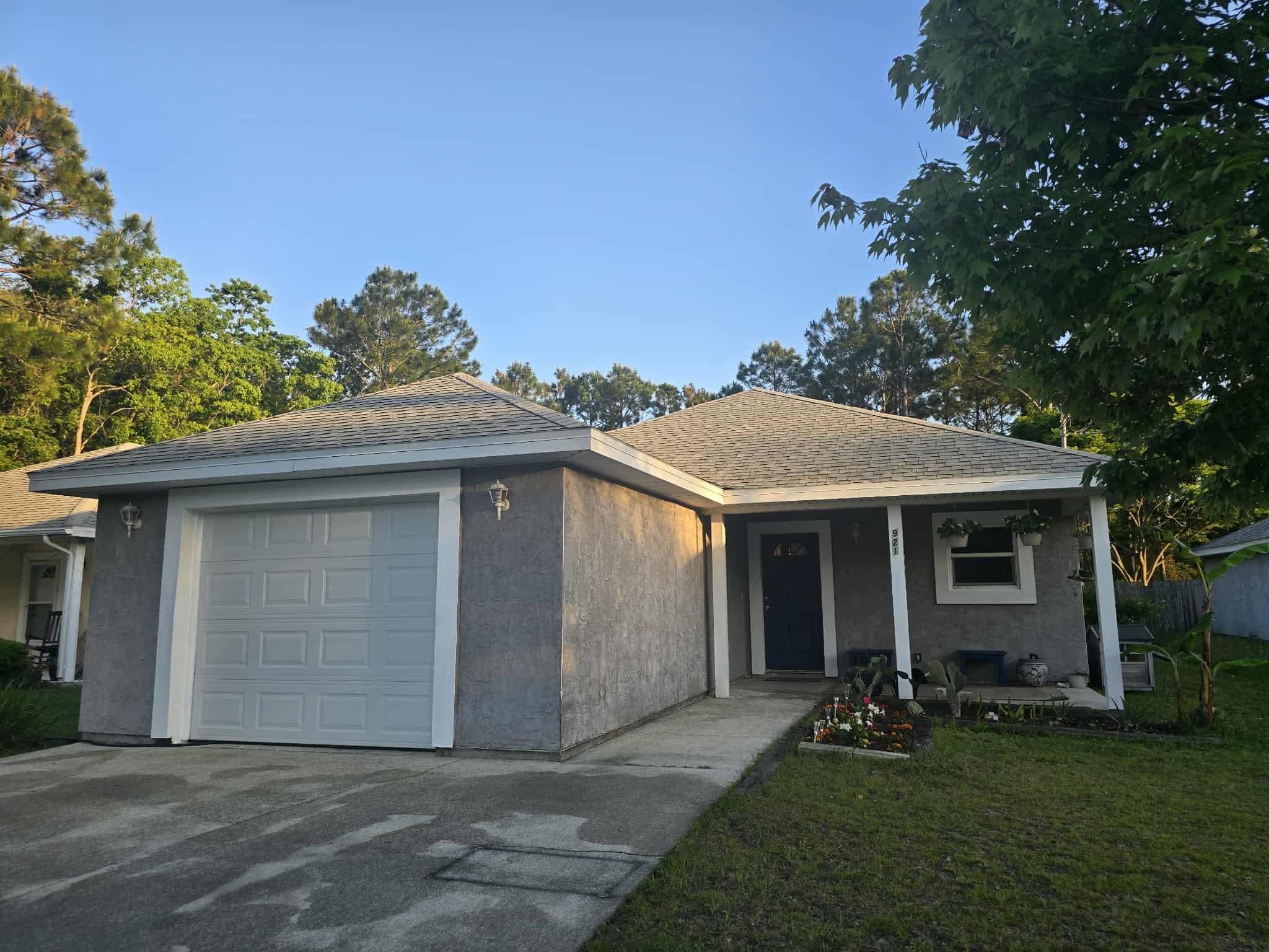 921 Avery Street St. Augustine, FL 32084 - Photo 25 of 29 a front view of a house with a yard and garage