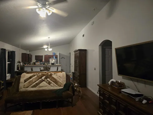 a living room with furniture and a flat screen tv