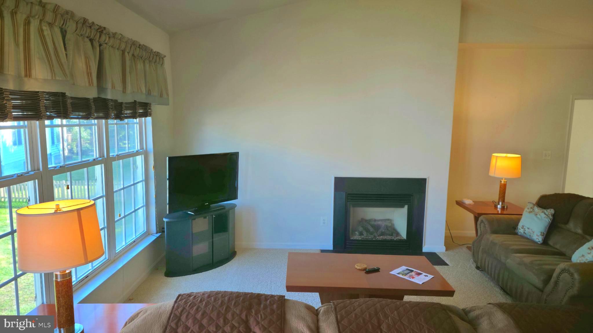 638 Hunters Road Culpeper, VA 22701 - Photo 14 of 46 a bedroom with a bed and glass window