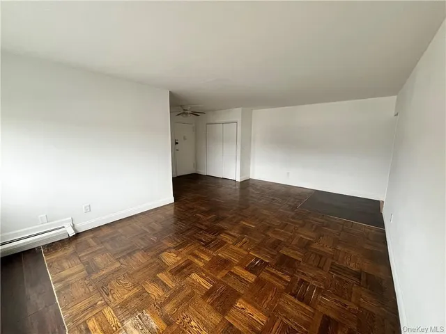 an empty room with wooden floor