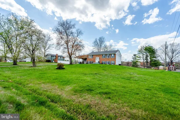 a view of a house with a back yard