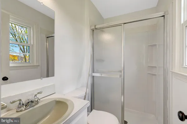 a bathroom with a sink a toilet and bathtub