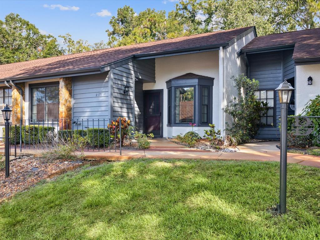 2171 Forester Way Spring Hill, FL 34606 - Photo 1 of 1 a view of a house with a yard and plants