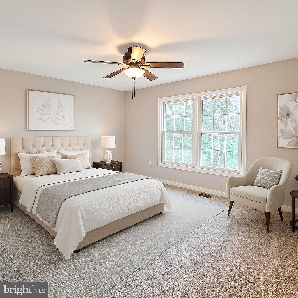 11219 Station Road Worton, MD 21678 - Photo 15 of 21 a bedroom with bed and windows