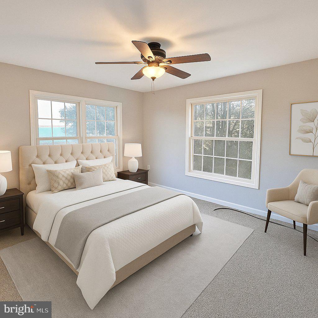 11219 Station Road Worton, MD 21678 - Photo 16 of 21 a spacious bedroom with a bed and a large window