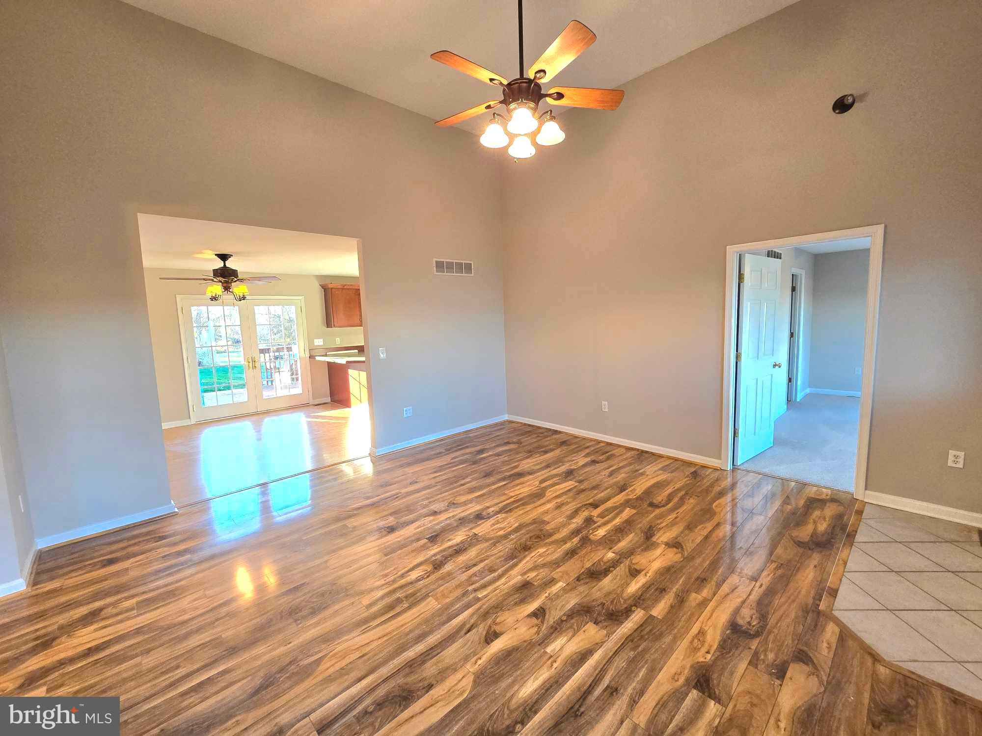 11219 Station Road Worton, MD 21678 - Photo 4 of 21 a view of a room with wooden floor and a ceiling fan