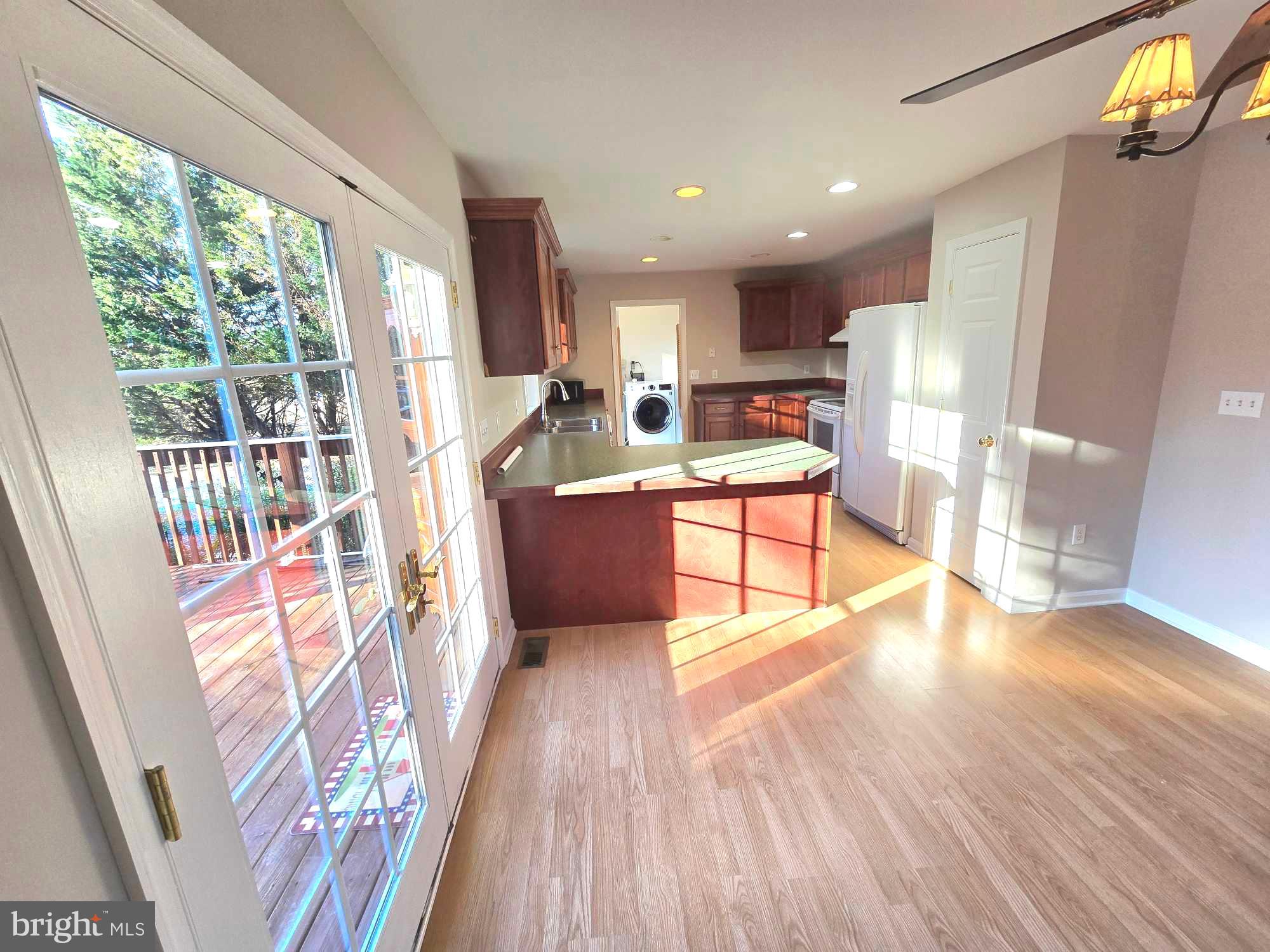 11219 Station Road Worton, MD 21678 - Photo 6 of 21 a living room with stainless steel appliances furniture wooden floor and a large window