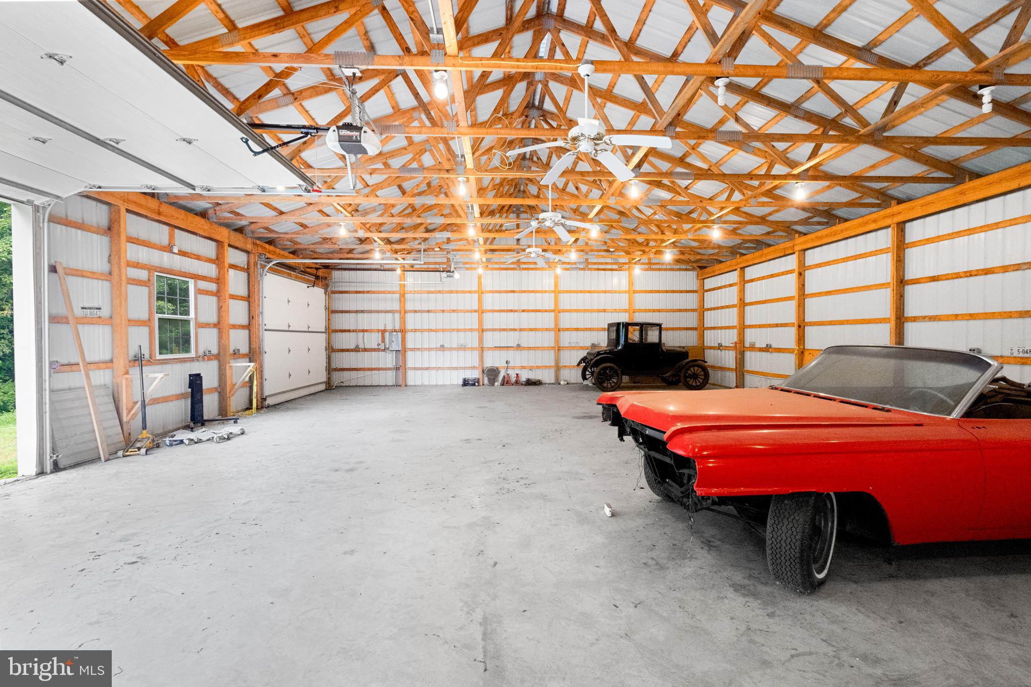 18189 Sands Road Purcellville, VA 20132 - Photo 89 of 145 2 bay pole barn. Automatic doors. Ceiling fans.
