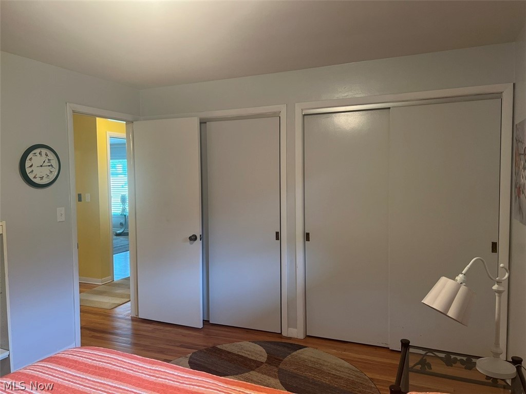 759 Truesdale Road Youngstown, OH 44511 - Photo 17 of 37 Bedroom featuring two closets and hardwood / wood-style flooring