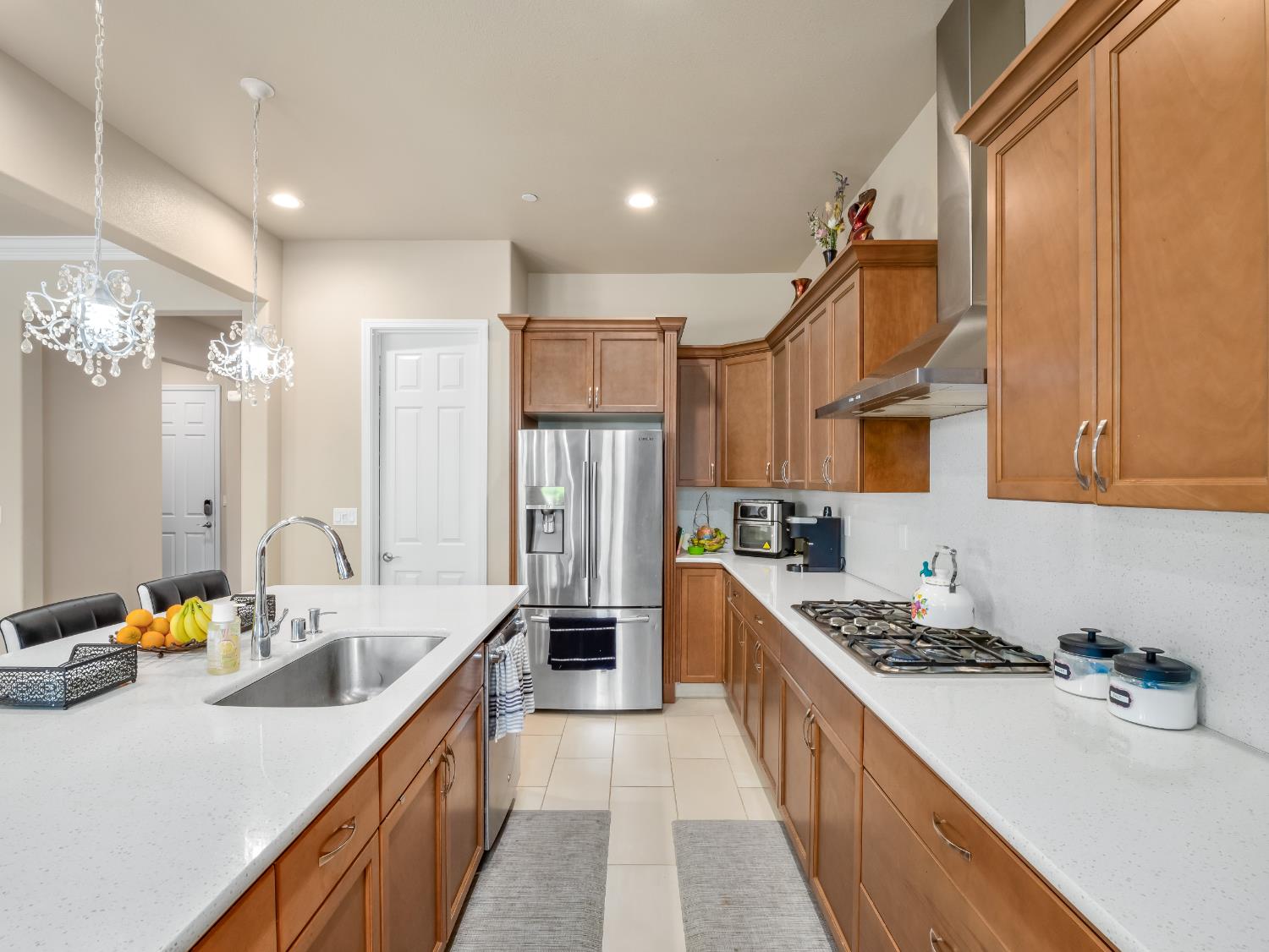 2127 Chennault Avenue Clovis, CA 93611 - Photo 14 of 49 a kitchen with stainless steel appliances a sink stove top oven and cabinets