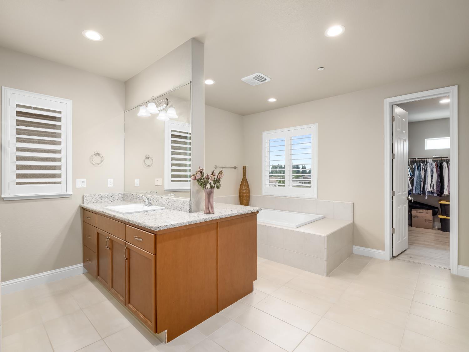 2127 Chennault Avenue Clovis, CA 93611 - Photo 33 of 49 a large kitchen with a sink a counter top and stainless steel appliances