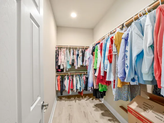a room with a sink and a mirror