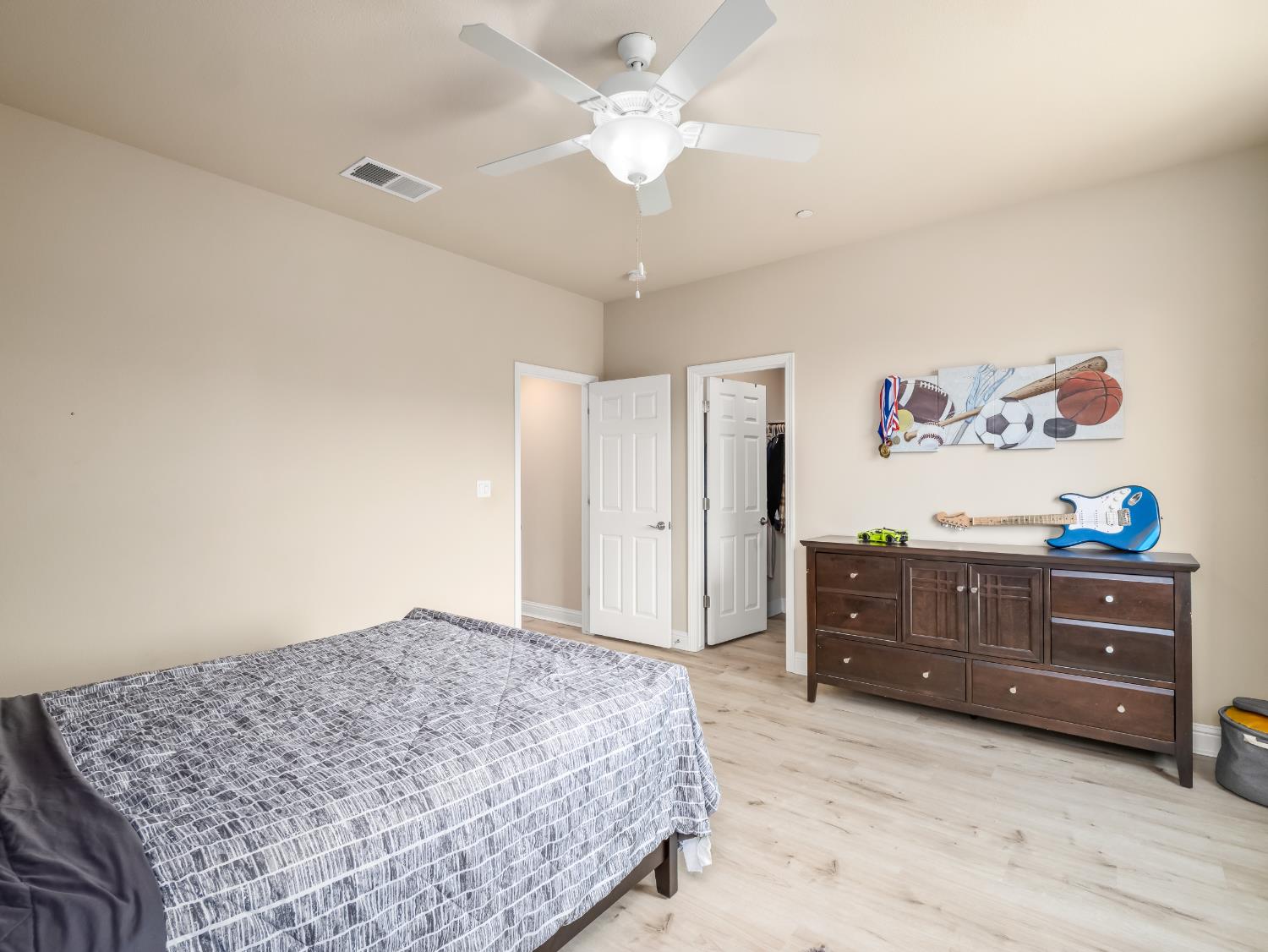 2127 Chennault Avenue Clovis, CA 93611 - Photo 41 of 49 a bedroom with a bed and a dresser