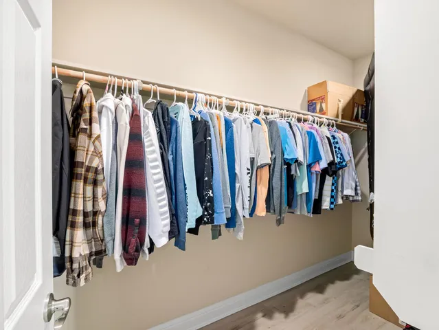 an aerial view of a house with a yard basket ball court and outdoor seating