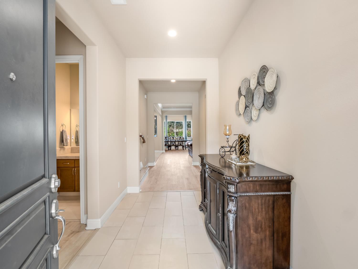 2127 Chennault Avenue Clovis, CA 93611 - Photo 5 of 49 a view of a hallway with a livingroom and a bathroom