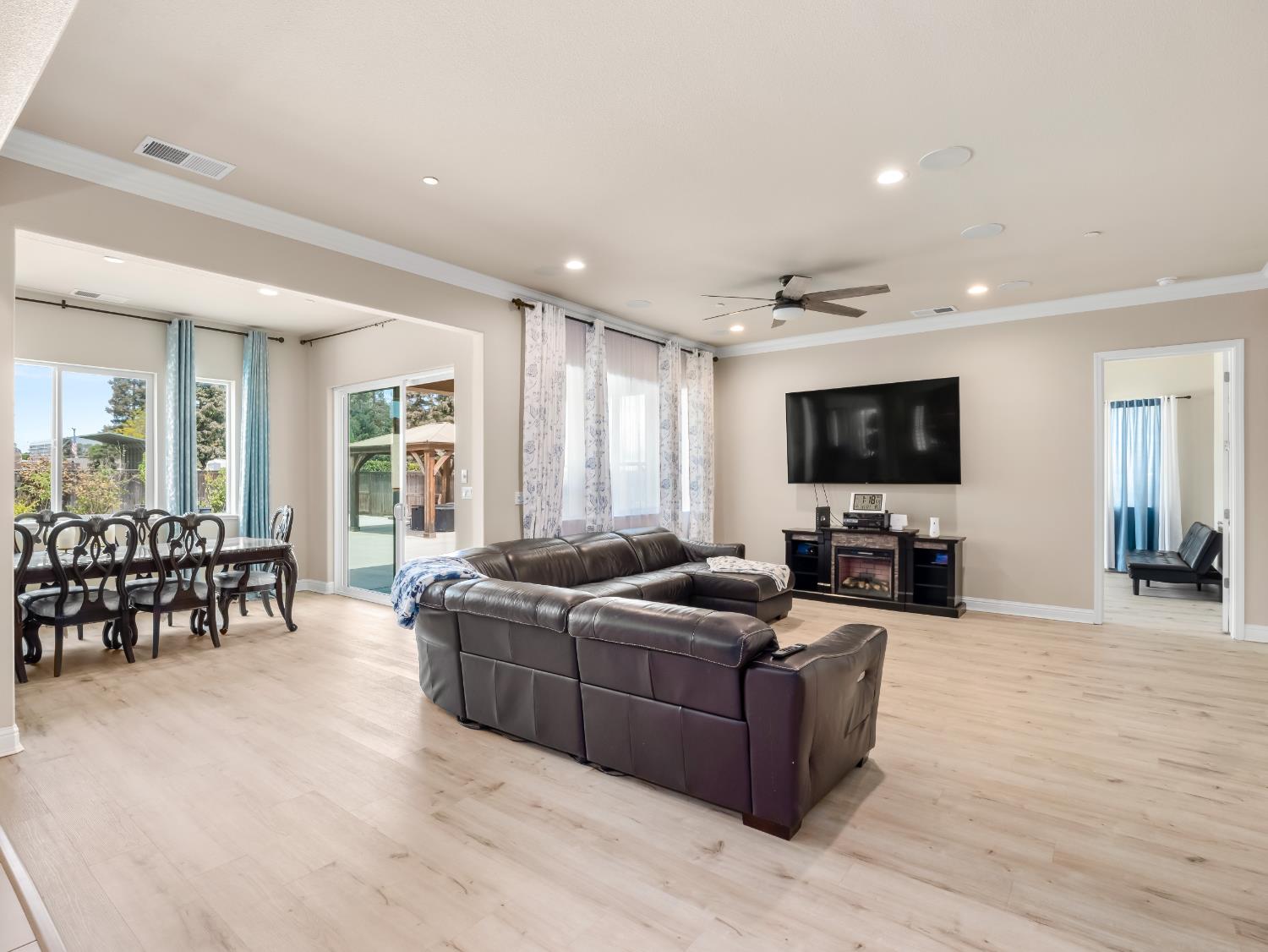 2127 Chennault Avenue Clovis, CA 93611 - Photo 6 of 49 a living room with furniture and a flat screen tv