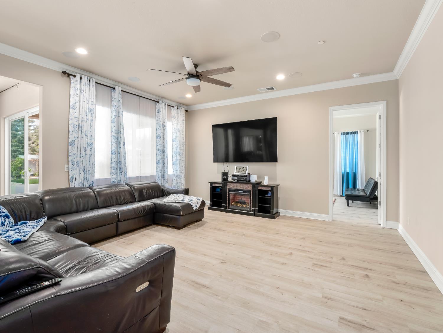 2127 Chennault Avenue Clovis, CA 93611 - Photo 8 of 49 a living room with furniture and a flat screen tv