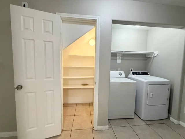 a utility room with dryer and washer