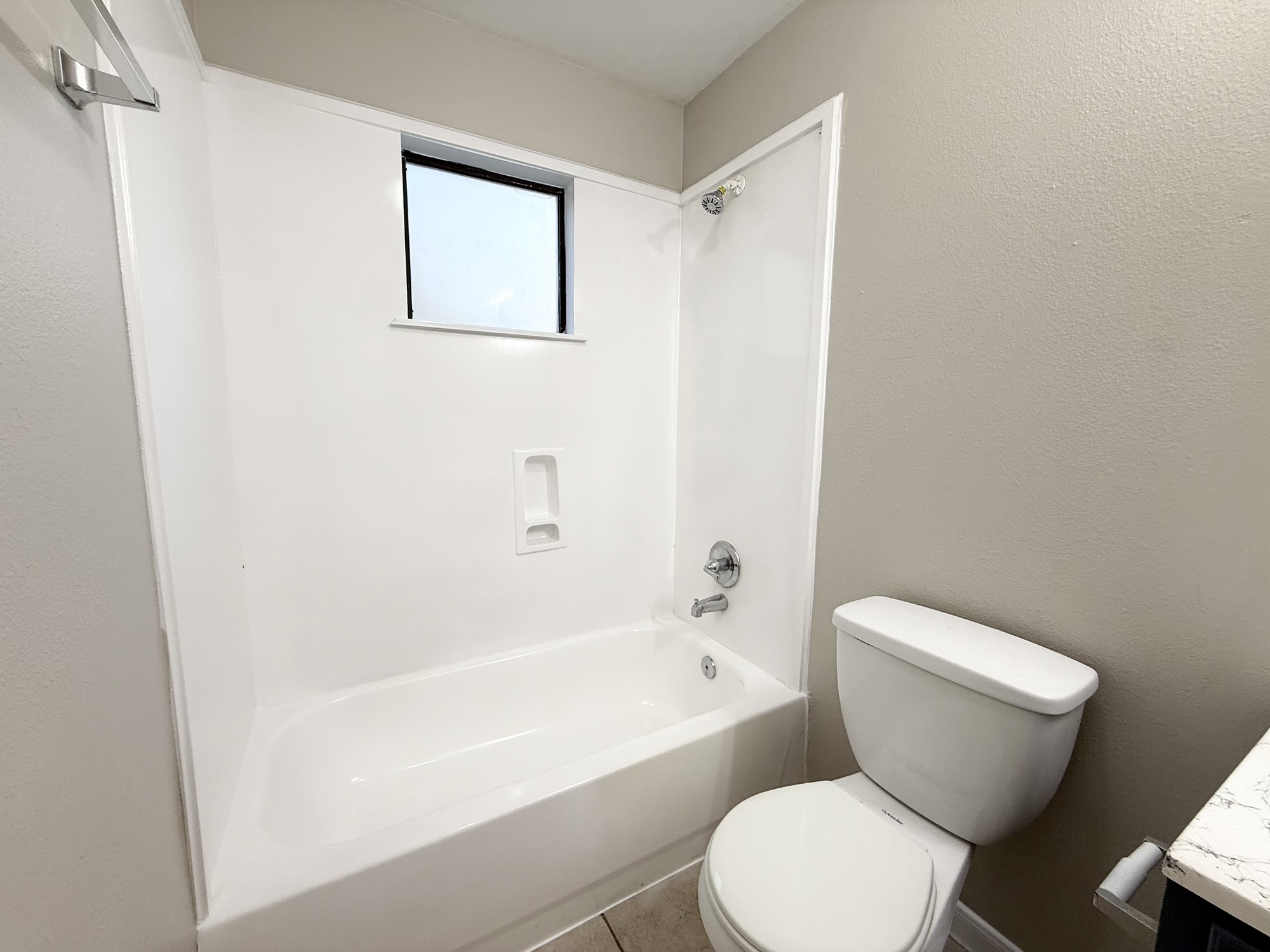 3032 La Estancia Lane Houston, TX 77093 - Photo 15 of 30 a white toilet sitting next to a bath tub