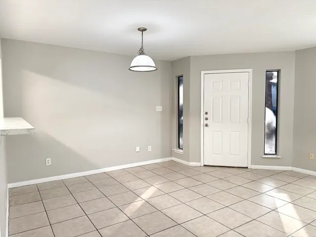 a view of an empty room and window