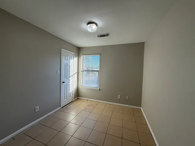 a view of an empty room and window