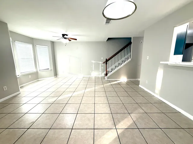 a view of an empty room and a window