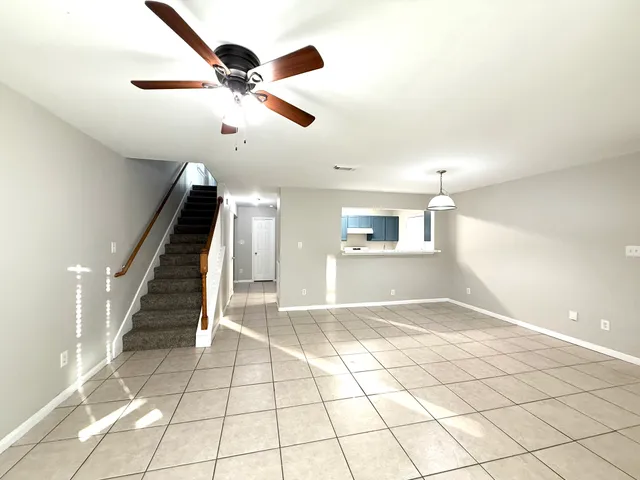 a view of an entryway and wooden floor