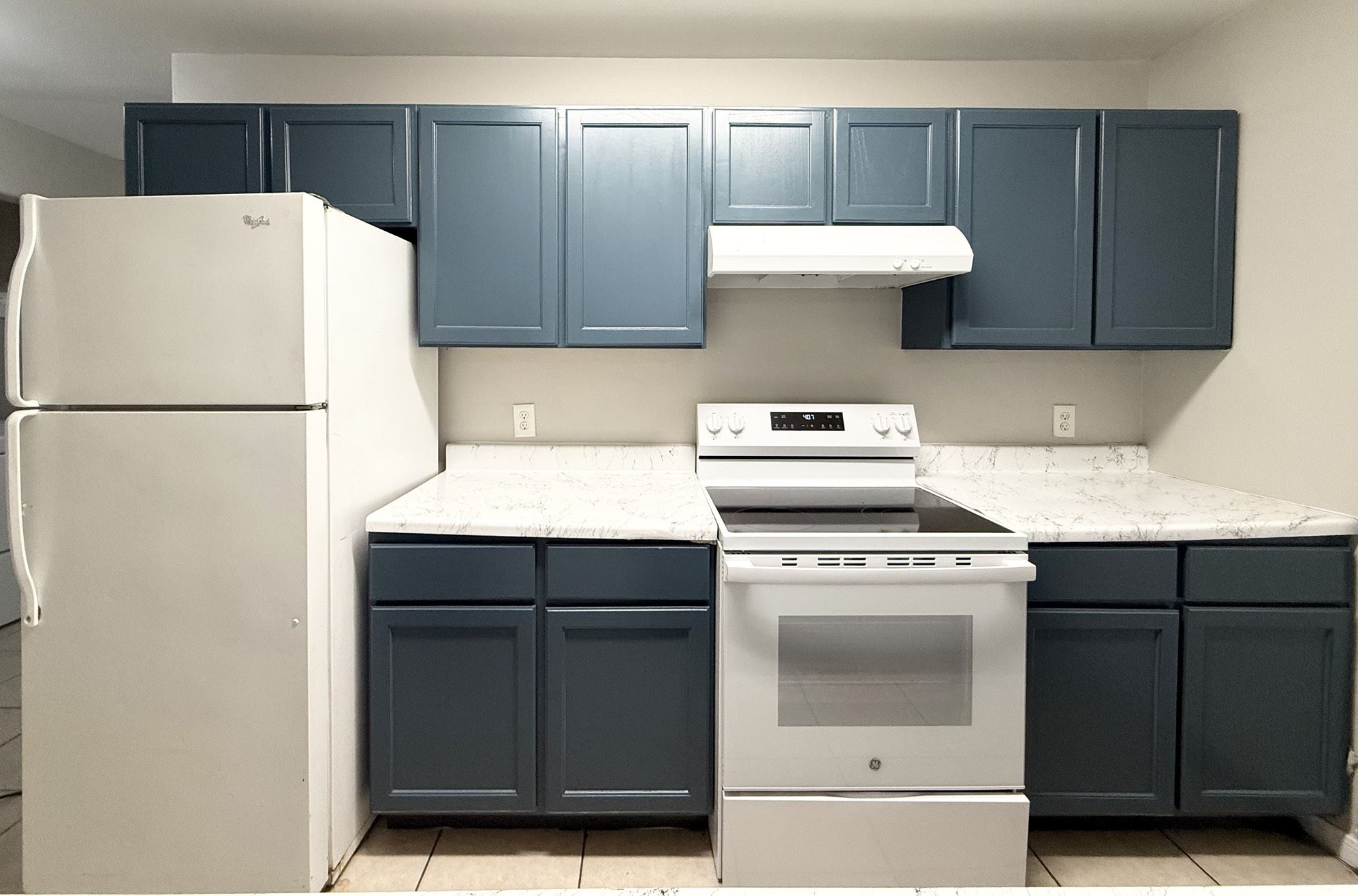 3032 La Estancia Lane Houston, TX 77093 - Photo 7 of 30 a kitchen with a stove and a refrigerator