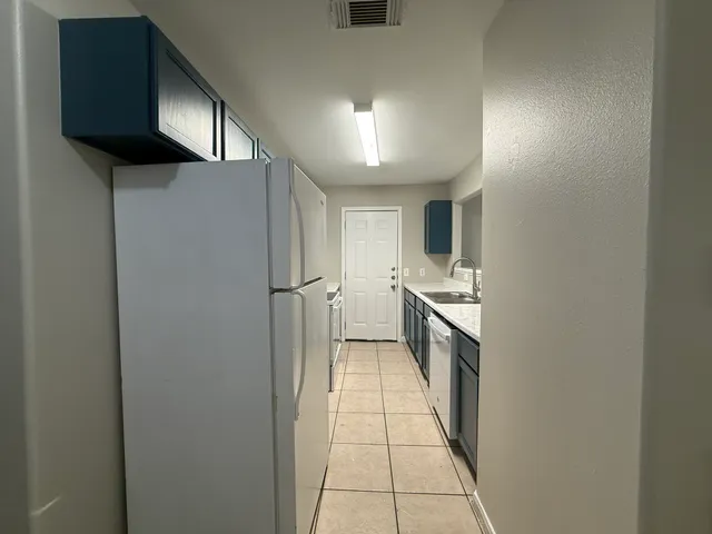 a hallway with cabinets