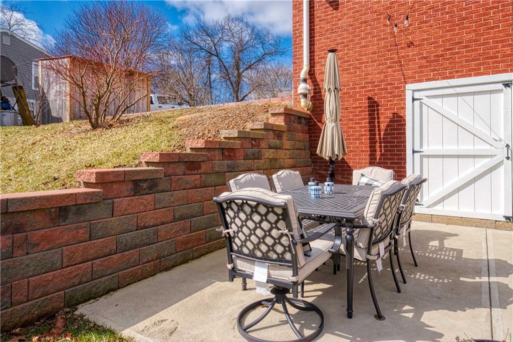 1384 Harmony Road Baden, PA 15005 - Photo 39 of 49 a view of a chairs and table in the patio