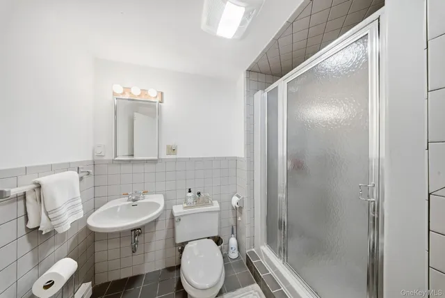 a bedroom with furniture and a chandelier