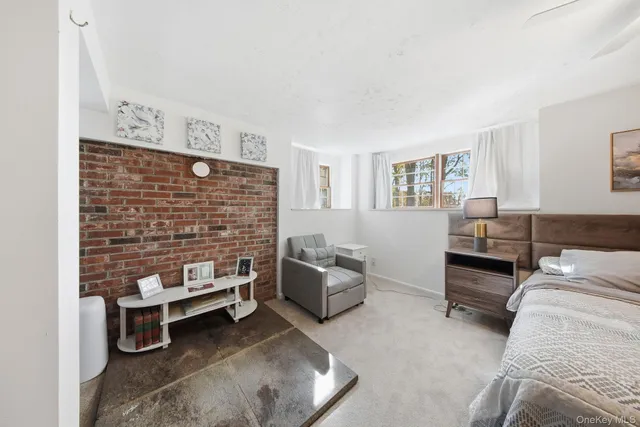 a spacious bedroom with a bed and window