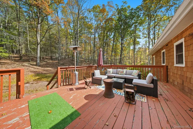 a view of balcony with outdoor seating and wooden floor