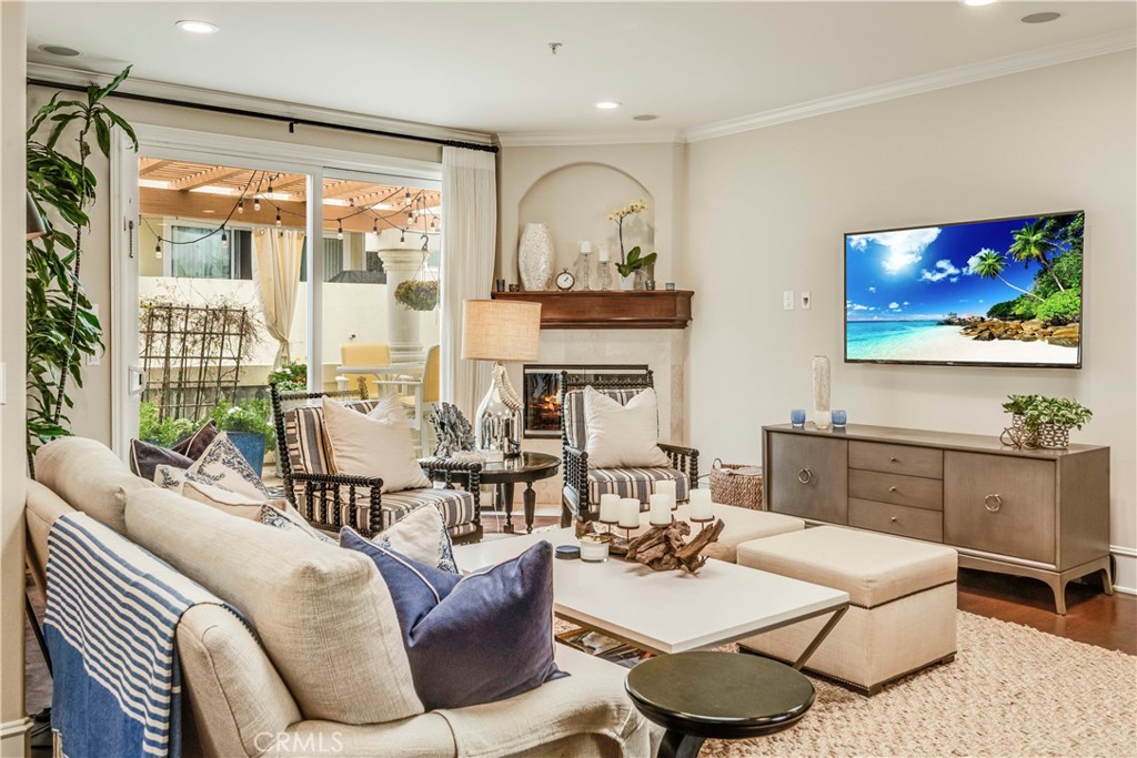 520 Esplanade, Unit D Redondo Beach, CA 90277 - Photo 12 of 24 a living room with furniture and a fireplace