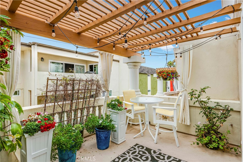520 Esplanade, Unit D Redondo Beach, CA 90277 - Photo 14 of 24 a view of a porch with furniture