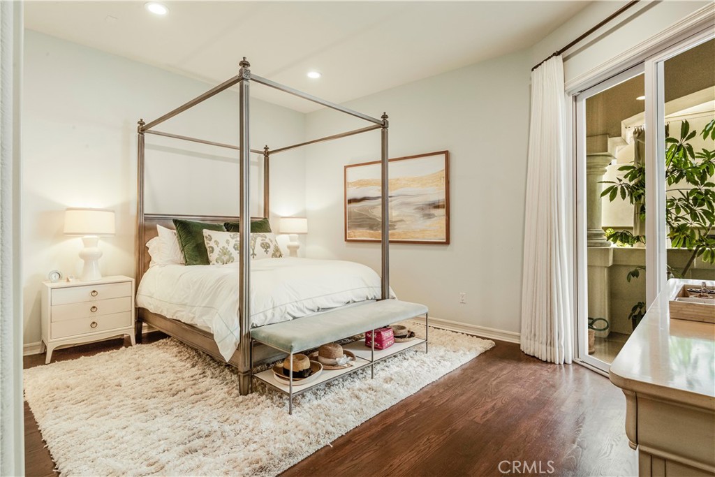 520 Esplanade, Unit D Redondo Beach, CA 90277 - Photo 15 of 24 a bedroom with a bed and a window