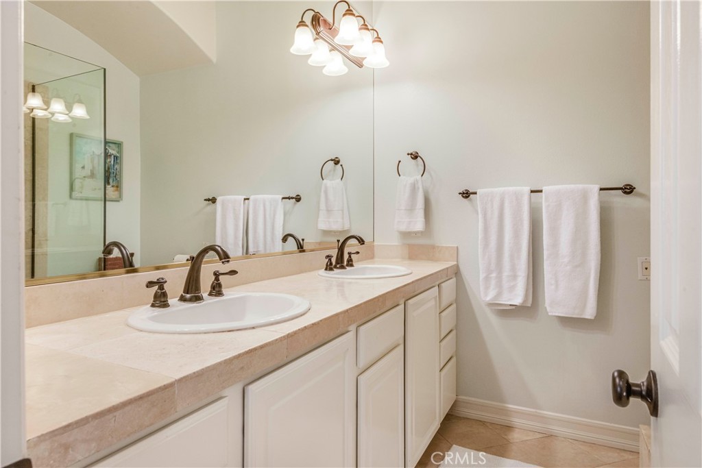 520 Esplanade, Unit D Redondo Beach, CA 90277 - Photo 17 of 24 a bathroom with a sink vanity and a mirror